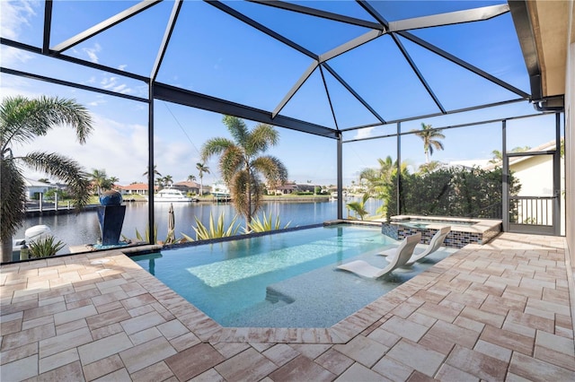 view of swimming pool featuring glass enclosure, a water view, an in ground hot tub, and a patio