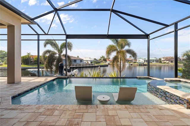 view of pool featuring an in ground hot tub, a patio, a water view, and a lanai