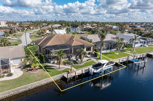 dock area featuring glass enclosure and a water view