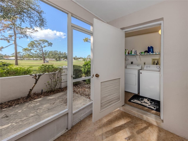 doorway to outside featuring washer and clothes dryer