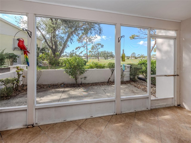 unfurnished sunroom featuring plenty of natural light