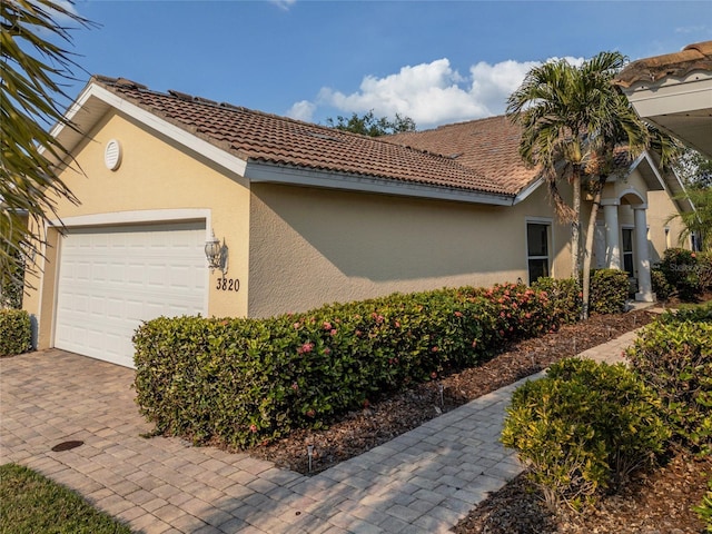 view of side of property featuring a garage