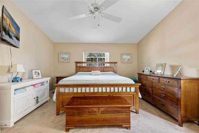 bedroom with ceiling fan and light carpet