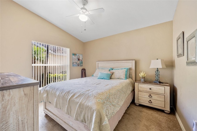 carpeted bedroom with ceiling fan and lofted ceiling