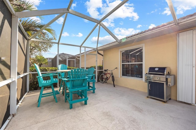 view of patio / terrace with a grill and a lanai