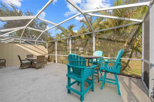 view of patio featuring a lanai