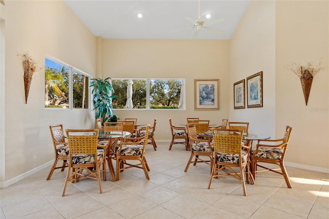 tiled dining area featuring ceiling fan