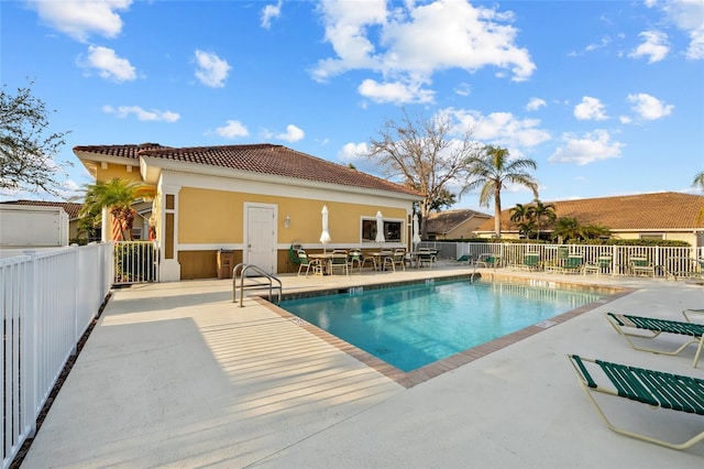 view of swimming pool with a patio area