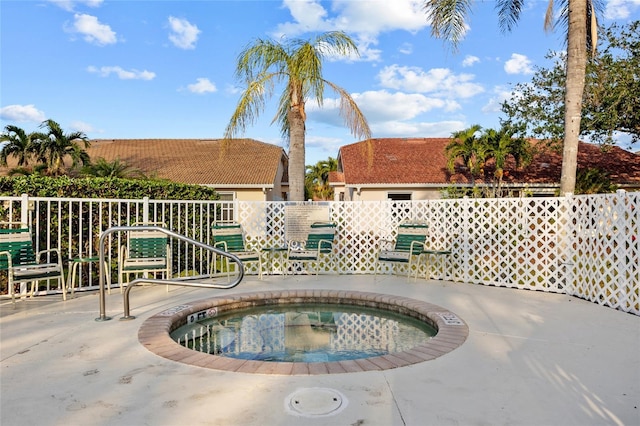 view of pool featuring a patio area and a hot tub