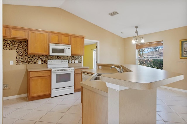 kitchen featuring light tile patterned flooring, white appliances, sink, and tasteful backsplash