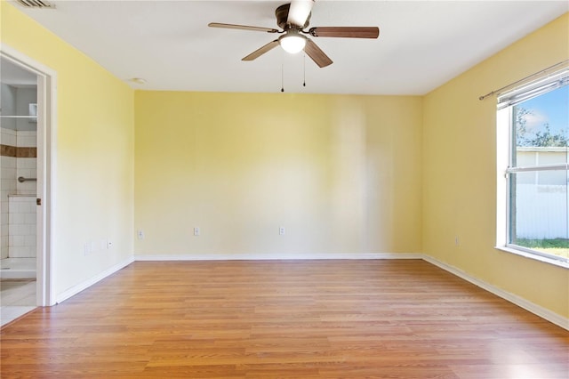 unfurnished room featuring light hardwood / wood-style floors and ceiling fan