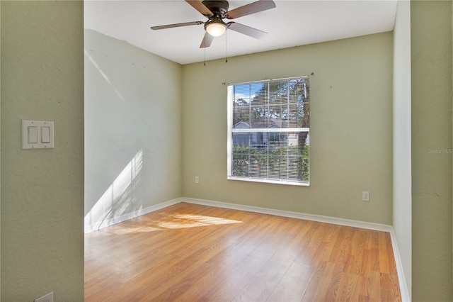 spare room featuring ceiling fan and light hardwood / wood-style flooring