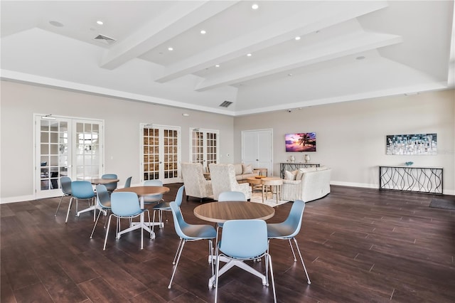 dining space with french doors, beamed ceiling, and a high ceiling