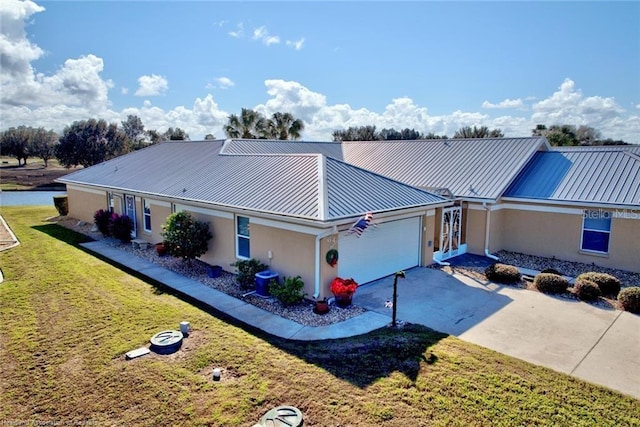 single story home with a front yard and a garage