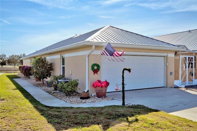 view of property exterior with a garage, a lawn, and central air condition unit