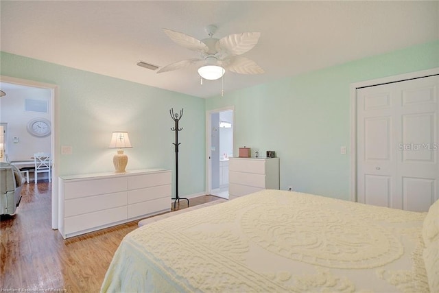 bedroom featuring wood-type flooring, a closet, and ceiling fan