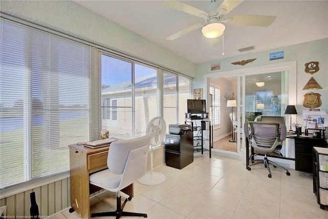 tiled office space featuring ceiling fan