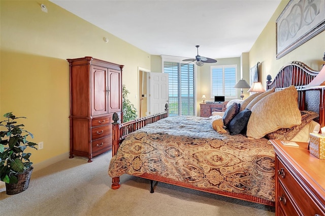 bedroom with ceiling fan and light colored carpet