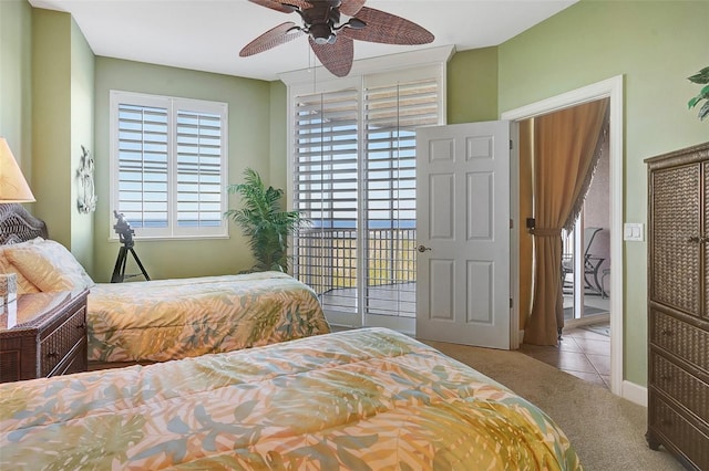 carpeted bedroom with access to outside and ceiling fan