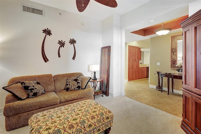 tiled living room featuring ceiling fan