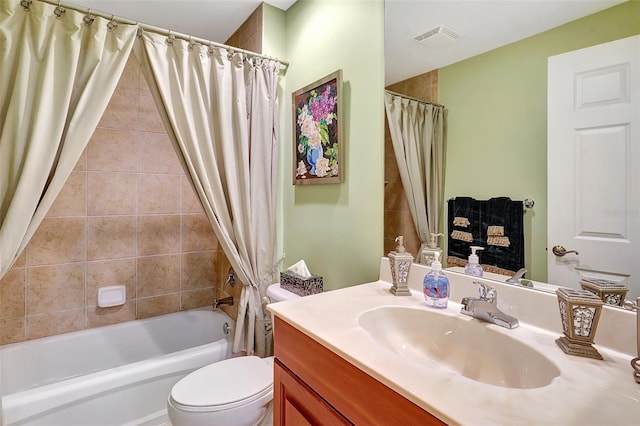 full bathroom featuring vanity, shower / tub combo, and toilet