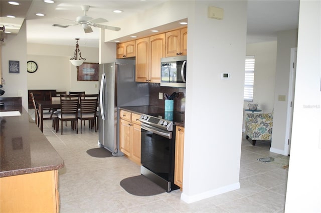 kitchen featuring pendant lighting, decorative backsplash, ceiling fan, light tile patterned floors, and appliances with stainless steel finishes