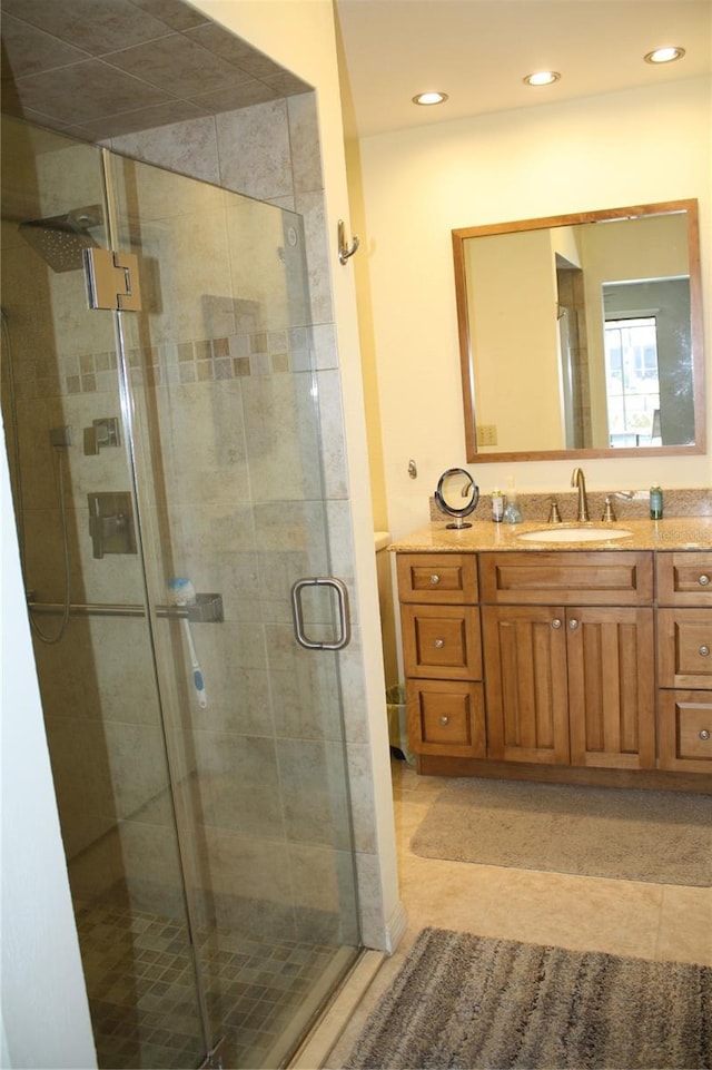 bathroom featuring vanity and walk in shower