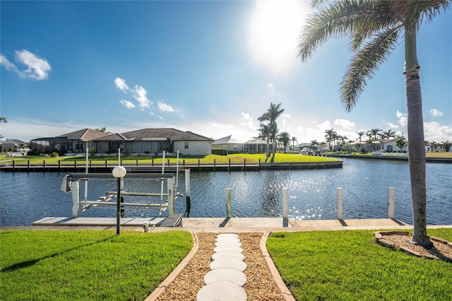 dock area featuring a yard and a water view