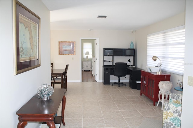 office area with light tile patterned flooring