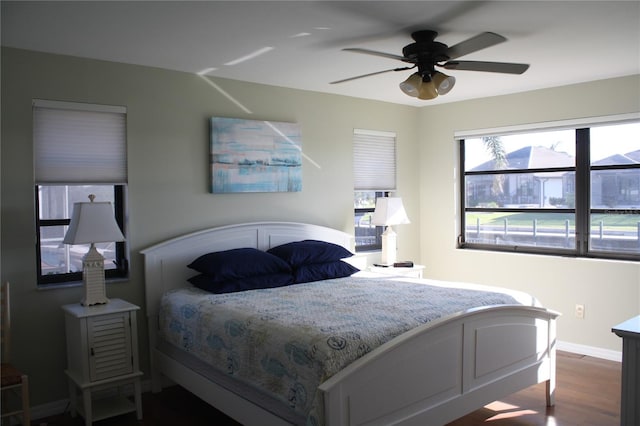 bedroom featuring hardwood / wood-style floors and ceiling fan