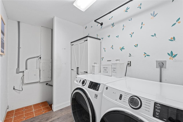 washroom featuring dark hardwood / wood-style flooring and washing machine and dryer