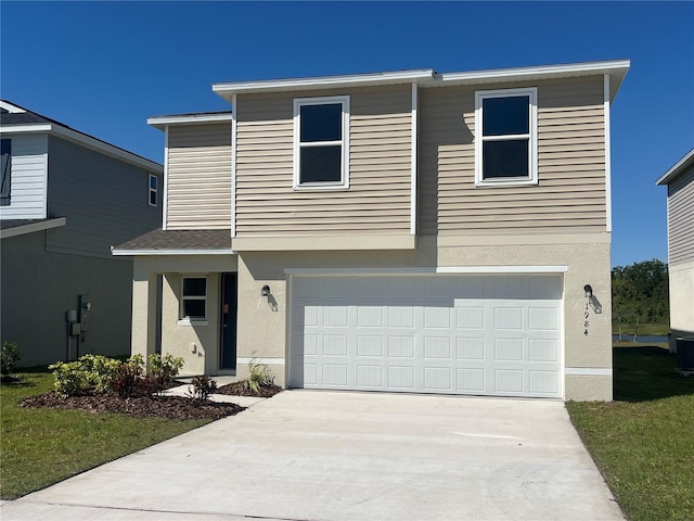 1984 Golden Beak Dr, Eagle Lake, FL 33839 - view of front facade featuring stucco siding, an attached garage, and concrete driveway