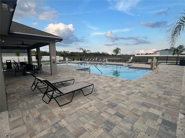 1984 Golden Beak Dr, Eagle Lake, FL 33839 - community pool with a patio and fence
