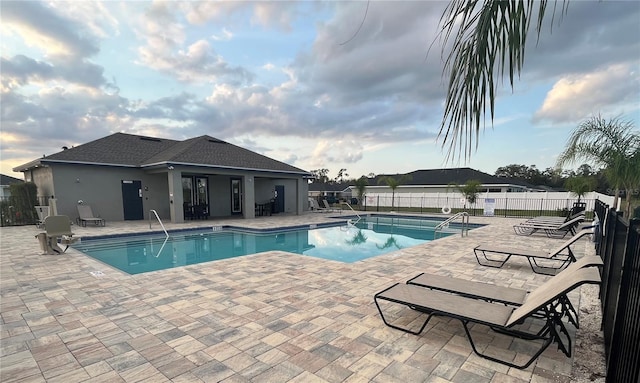 1984 Golden Beak Dr, Eagle Lake, FL 33839 - community pool featuring a patio and fence
