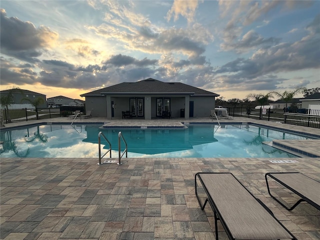 1984 Golden Beak Dr, Eagle Lake, FL 33839 - community pool with a patio and fence
