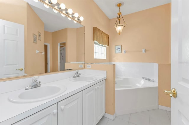 bathroom featuring a bath, vanity, and tile patterned floors