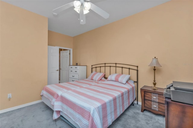 bedroom with ceiling fan and light carpet