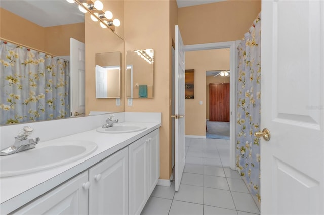 bathroom featuring tile patterned flooring and vanity