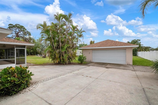 garage featuring a yard