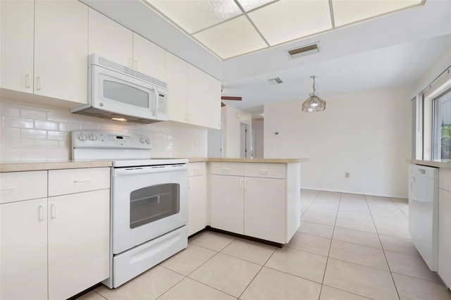 kitchen featuring kitchen peninsula, white cabinetry, white appliances, and hanging light fixtures