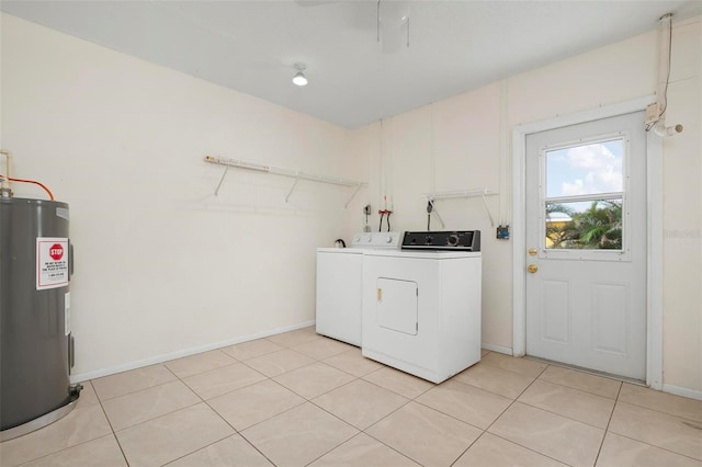 washroom with light tile patterned floors, separate washer and dryer, and water heater