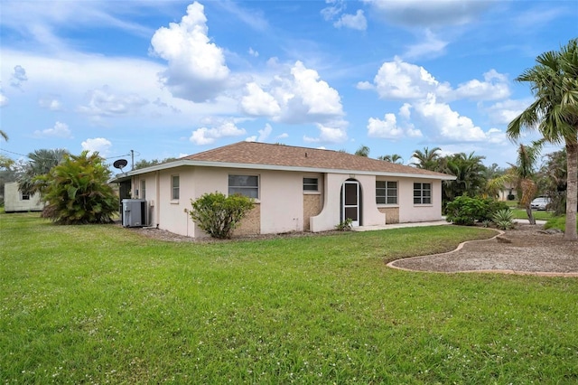 back of house with a yard