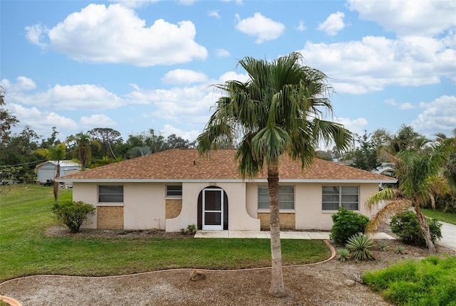 ranch-style home featuring a front yard