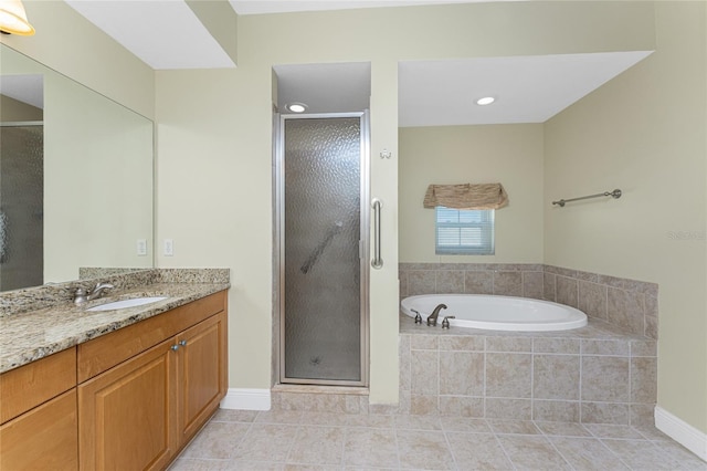 bathroom featuring tile patterned floors, vanity, and separate shower and tub