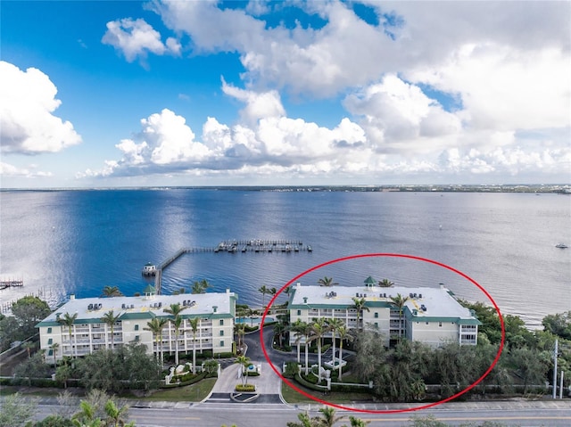 birds eye view of property featuring a water view