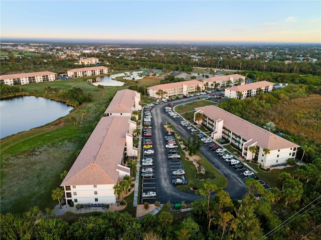 aerial view at dusk with a water view