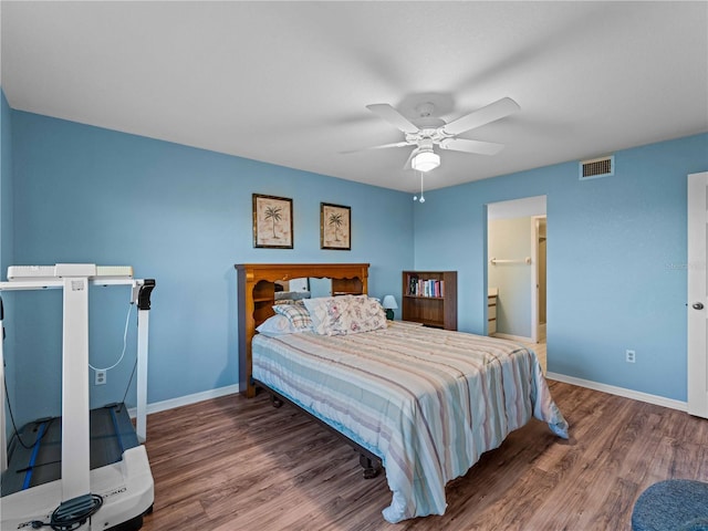 bedroom featuring ceiling fan, wood-type flooring, and connected bathroom