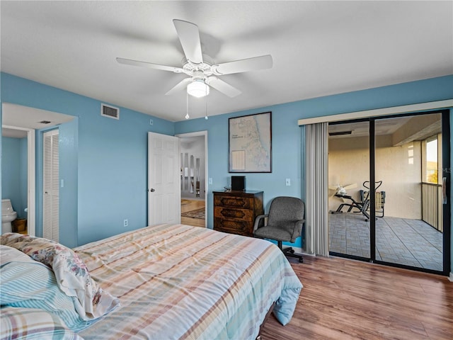 bedroom featuring hardwood / wood-style flooring, ceiling fan, and ensuite bathroom