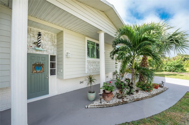 doorway to property with a porch