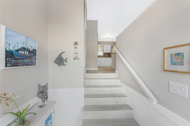 staircase featuring hardwood / wood-style floors